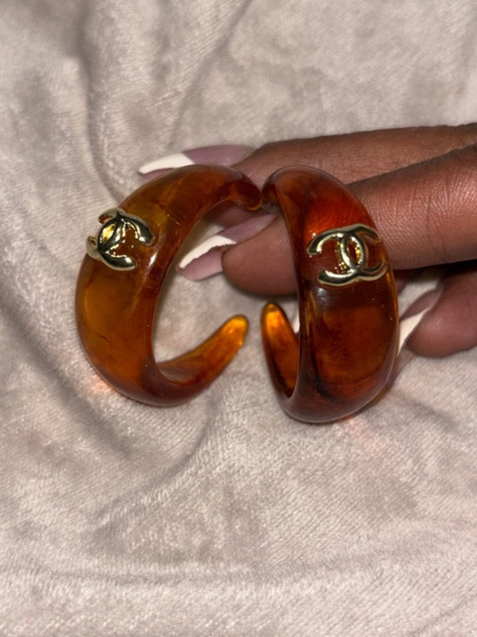 Amber Resin Hoop Earrings with Gold CC Emblems